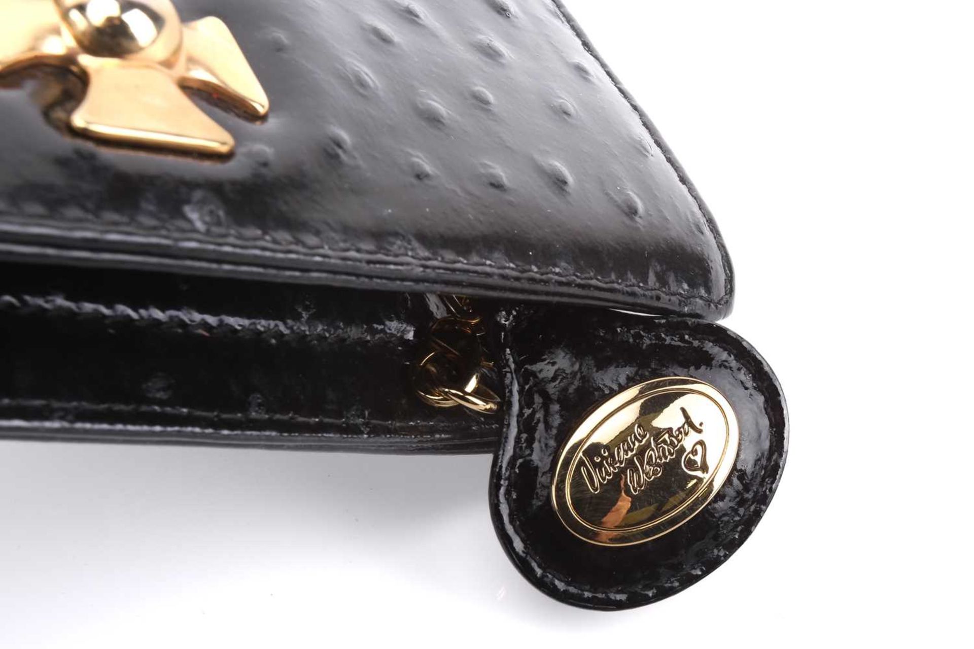 Vivienne Westwood - an extra long clutch in black patent mock ostrich leather, embellished with - Image 4 of 7