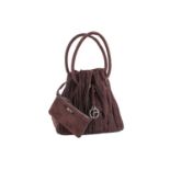 Giorgio Armani - a pleated bucket bag in brown suede, with rounded top handles, a logo charm and a