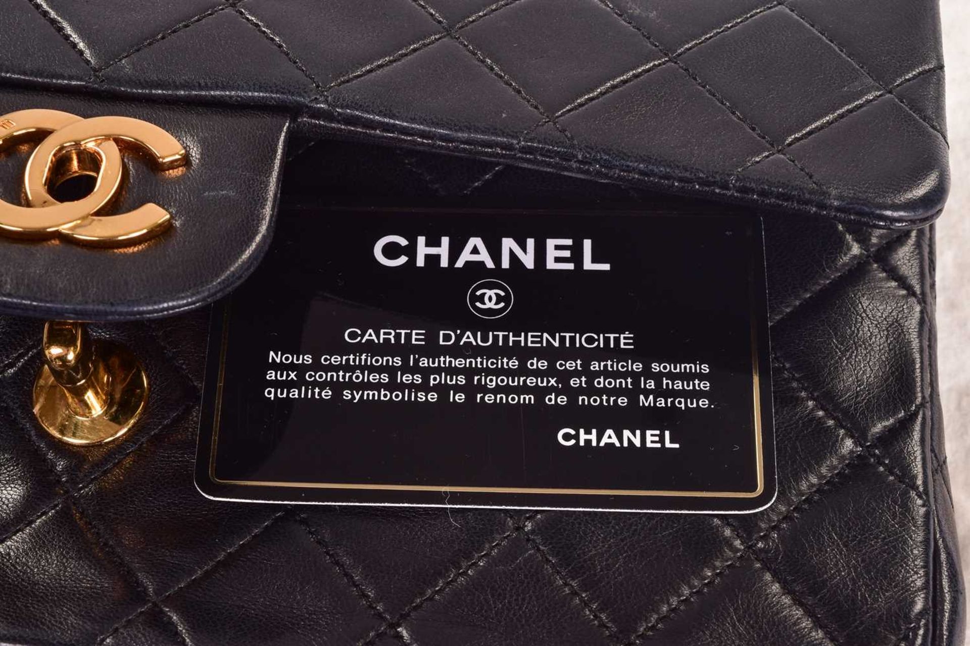 Chanel - a small double flap handbag in black lambskin, circa 1989, diamond-quilt rectangular body - Image 10 of 11