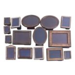 Fourteen decorative silver-fronted easel photograph frames.