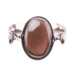 Georg Jensen - 'Arm Ring' with smokey quartz, a tension clamp opening bangle with an oval panel of