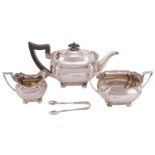 An Edwardian three-piece tea service, by Maple & Co, Sheffield 1910, of boat form with fluted