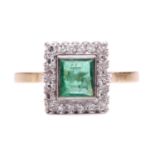 An emerald and diamond halo ring, featuring a rectangular step-cut emerald of bright green colour,