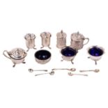 A small group of four early 20th century silver table cruet items together with three items of