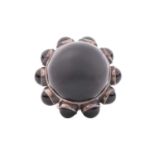 Georg Jensen - a large onyx cocktail ring, encircled with onyx cabochon ornaments around the collet,