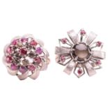 Two floral cocktail rings set with ruby and black star sapphire; the first centred with a round