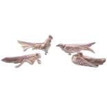 Four silver plated knife rests in the manner of Christofle, Cubist-inspired, comprising an eagle,