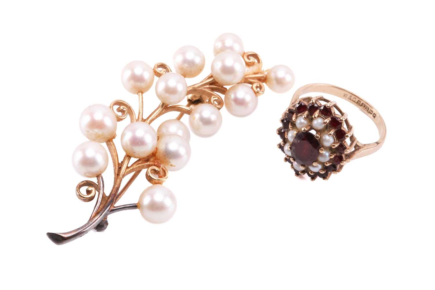 A garnet and seed pearl cluster ring with hallmarks for 9ct gold, ring size K 1/2, and a cultured