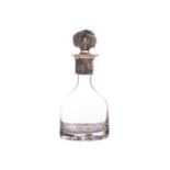 An unusual Australian novelty decanter set with an opal. The dimpled bell-shaped plain glass body