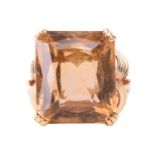 A single stone citrine dress ring, the large rectangular mixed cut, cut-cornered citrine in ribbed