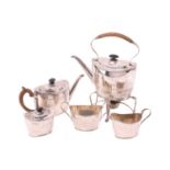 An Edwardian silver five-piece tea service, in the George III style, comprising a spirit kettle,