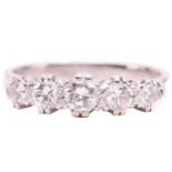 A diamond five-stone ring, set with a graduated row of round brilliant cut diamonds with a total