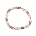 A French sapphire and diamond line bracelet; composed of alternating panels of six stone circular