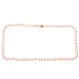 A single-row baroque pearl necklace, composed of sixty-three, creamy white baroque pearls of varying
