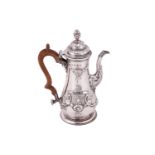A George II silver coffee pot, by Thomas Moore II, London 1759, of baluster form, body chased with