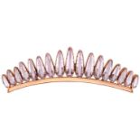 An early Victorian pink topaz tiara hair piece, later converted to a brooch, set with a row of