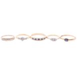 Five gem-set rings, to include a diamond three stone ring, testing as 18ct, ring size J, an old