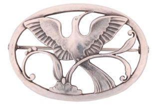 Georg Jensen - a Bird of Paradise openwork brooch, depicting a bird spreading wings amongst the