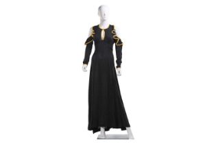 Ossie Clark - a black moss crepe full-length evening dress with signature cut-out shoulders ruffle