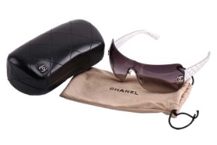 Chanel - a pair of rimless shield sunglasses with metallic silver diamond-quilted temples,