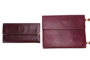 Must de Cartier - a long wallet and a shoulder bag in burgundy leather; the wallet with smooth