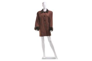 Yves Saint Laurent - a brown medium coat with nutria fur trim, circa 1990s, with button front