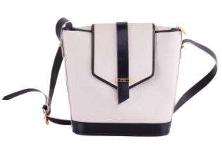 Yves Saint Laurent - a flap crossbody bag in white coated canvas and navy leather trims, circa 1980,