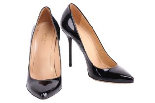 Gucci - a pair of pointed-toe court shoes in black patent leather, leather-lined insole and outsole,