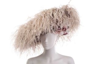 A Philip Treacy fascinator with grey falling feathers around the brim, adorned with two hand-painted