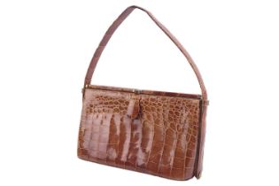 A Waldybag top handle in cognac brown crocodile skin, circa the 1950s, framed body open to reveal