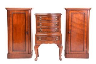 A pair of Victorian mahogany pedestal night cupboards with radius corners and single-panelled