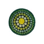 A "mid-century vintage" hand-knotted circular "Shag" rug, 1960s, in tones of green with a large