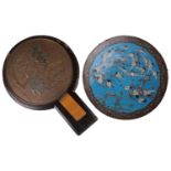 A lacquer-cased Japanese bronze mirror, with cast fan decoration, 40 cm long, and a cloisonne