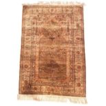 A Turkish silk Hereke prayer rug, 20th century, with a faded green ground and distinctive hipped