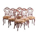 A set of six good quality Victorian "Crown Back" dining chairs with serpentine seats and carved