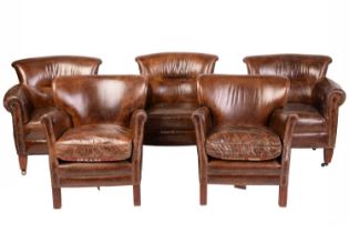 A set of three Edwardian-style distressed brown hide scroll-backed tub chairs, 20th century, with