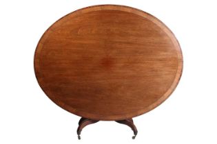 George IV mahogany and rosewood crossbanded oval breakfast table the base with four inverted sabre