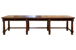 A large 18th-century-style rectangular oak library directory table, with a planked top with