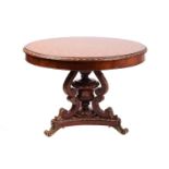 A French Empire style parquetry inlaid mahogany circular centre table, 20th century, with central