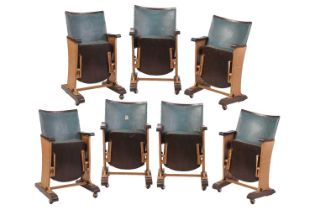 A set of seven Art Deco cast iron single-seat Cinema seats with reeded supports and original