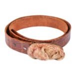 A Chinese carved jade belt buckle with 14k rose gold fittings, the buckle is in the form of two