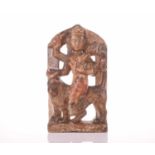 An Indian carved and pierced marble figure group of Durga riding on the back of a tiger, possibly