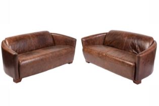 A pair of art deco style distressed brown hide two-seat sofas with swept arms and block feet. 167 cm