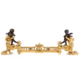 A pair of Napoleon III style figural chenets, with patinated amorini mounted at each end, standing