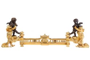 A pair of Napoleon III style figural chenets, with patinated amorini mounted at each end, standing