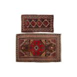 A red ground antique Caucasian probably Karadagh rug with a central lozenge with both, peacocks, and