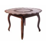 An early 20th-century Indo-Portuguese padauk centre table with pierced and carved crescent