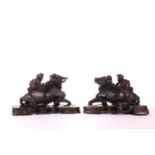A pair of Chinese-carved padauk wood figures of the boy on a buffalo, early 20th century. 24 cm