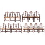 A set of fourteen Hepplewhite style mahogany open armchairs with pierced bullrush splats and drop-in