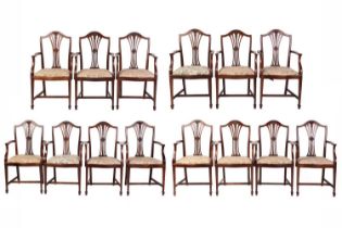 A set of fourteen Hepplewhite style mahogany open armchairs with pierced bullrush splats and drop-in